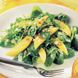 Mango on a bed of green leaves