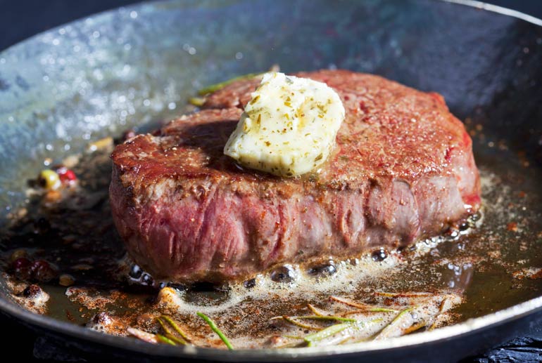 9. Enjoy a grass-fed steak with butter