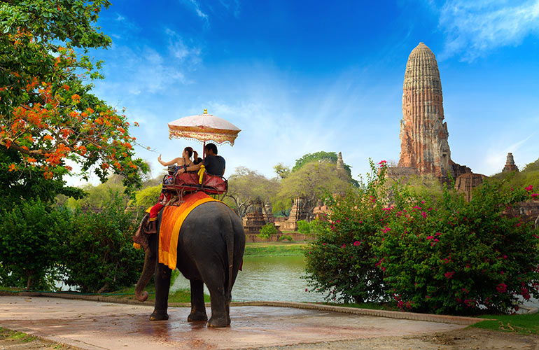 Riding elephants in Thailand