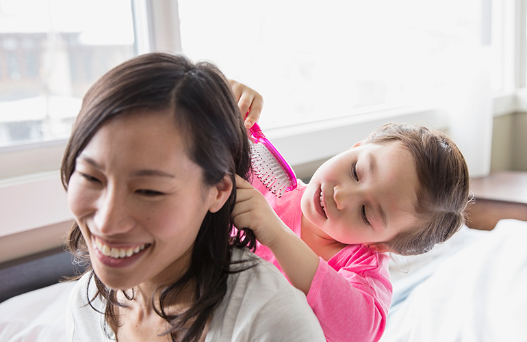 Having your hair brushed