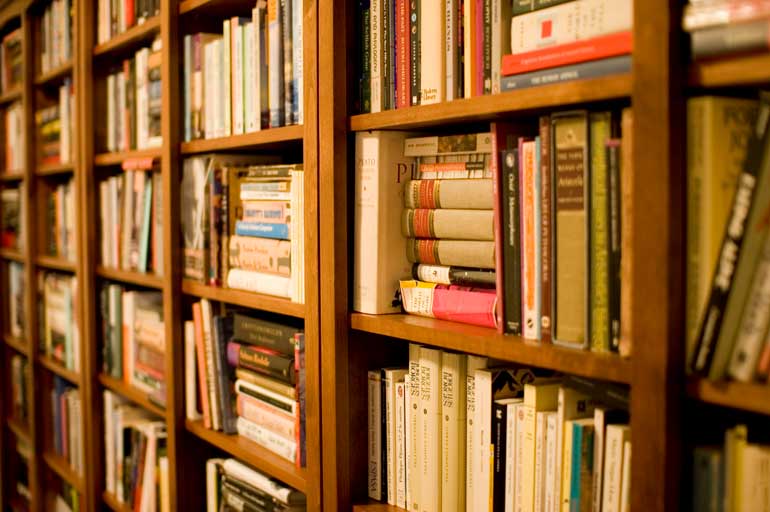 Behind books