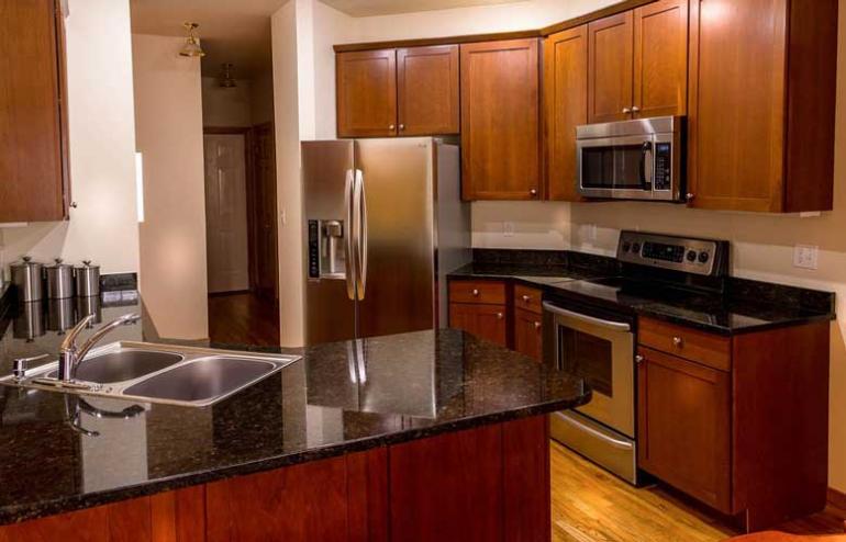 Step 4. Tackle one section of cabinets each time you clean