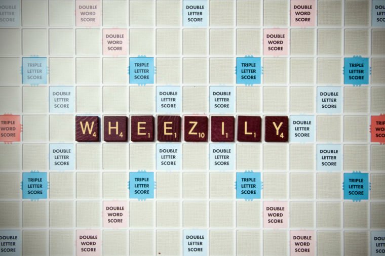 Wheezily: With a wheeze