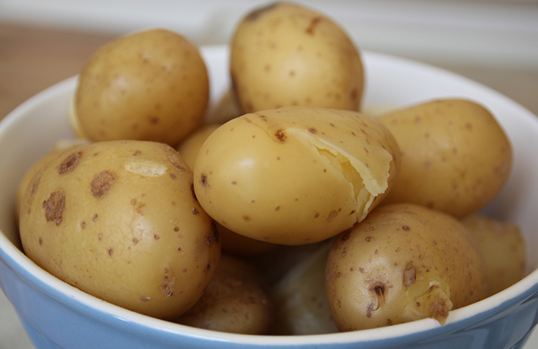 Boil potatoes before baking