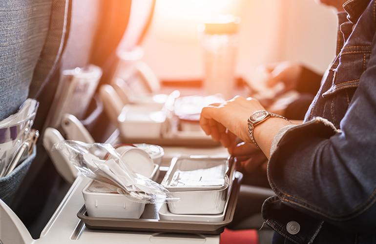 How many kilojoules does the average person consume on a flight?