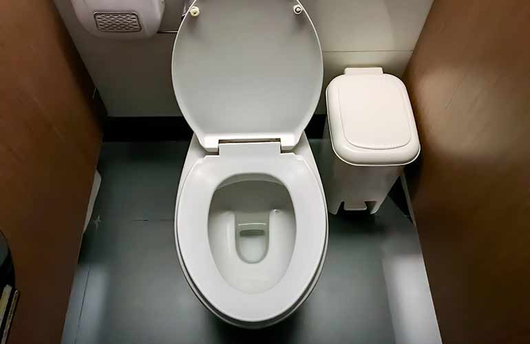 Hovering over the seat to urinate