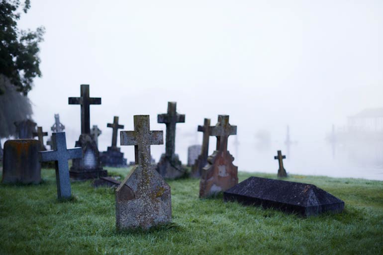 Digging graves six feet deep