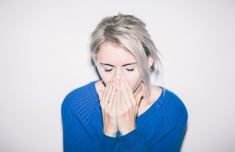 Sneezing into your hands