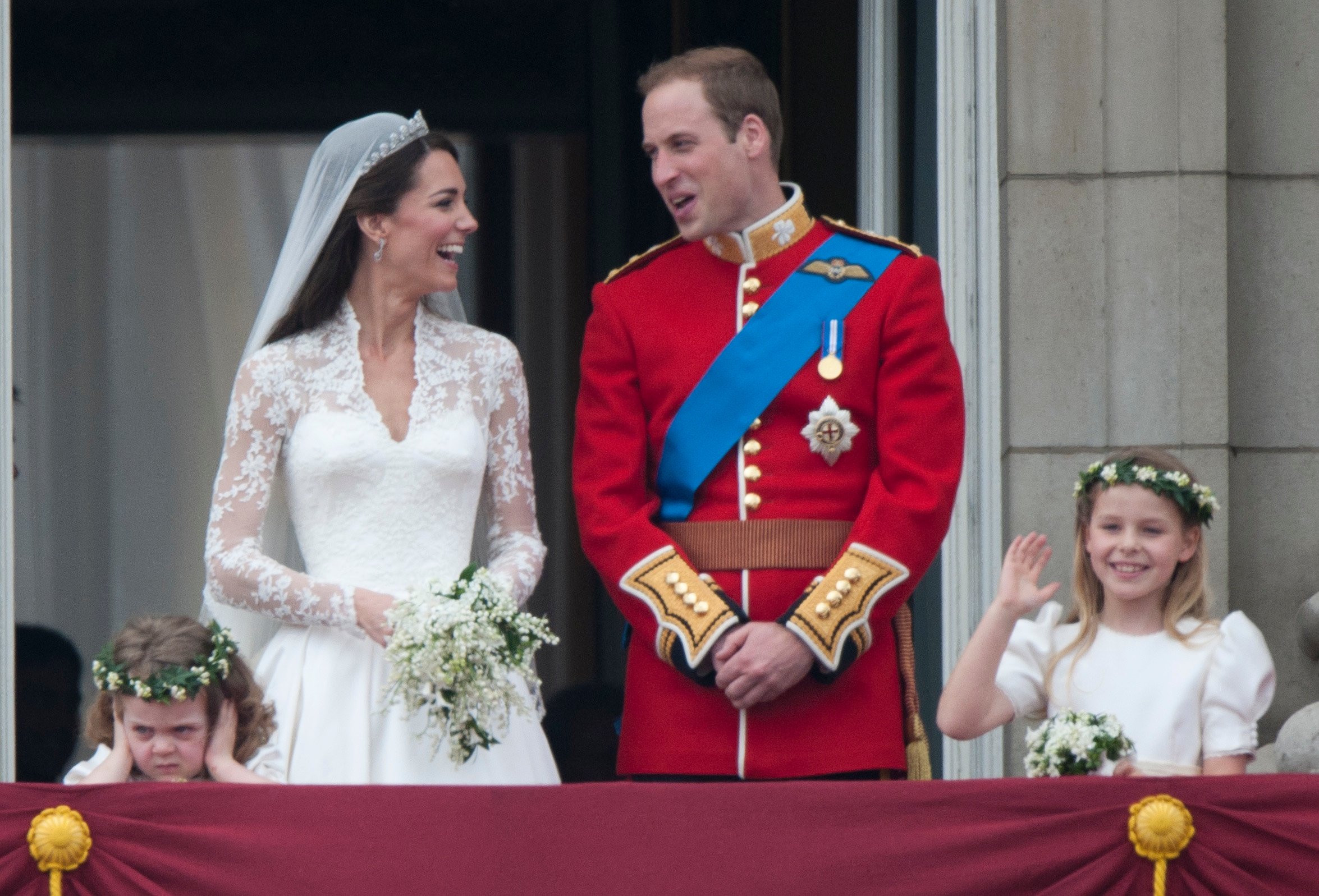 Greeting the crowd right after their wedding