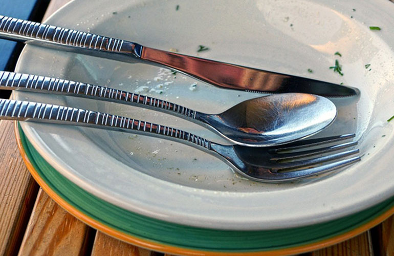 Stacking used plates at the table