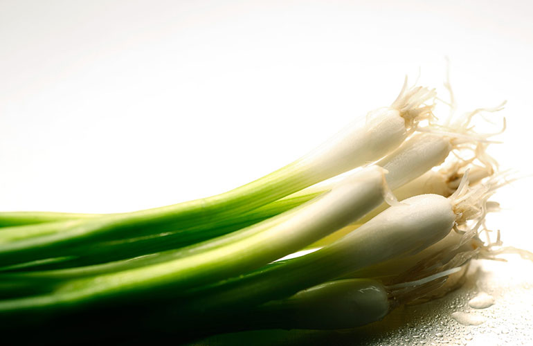 Sprinkle spring onions over your salad