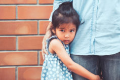Anxious child attached to parent