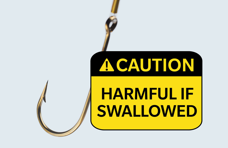 Warning label on a brass fishing hook: