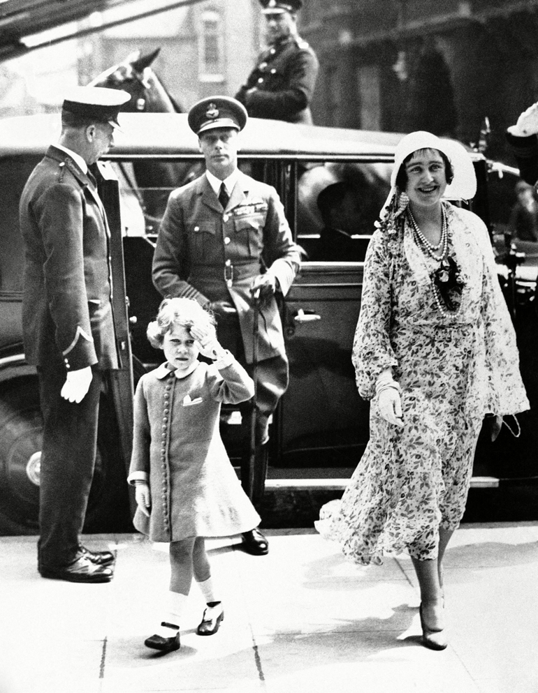 Daddy’s in military garb; a princess salutes