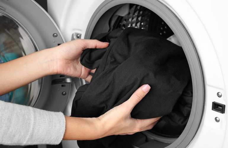 Not taking clothes out of the washer right away