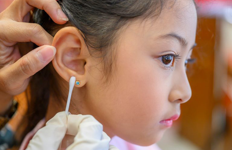 Rubbing alcohol use: Ear piercing