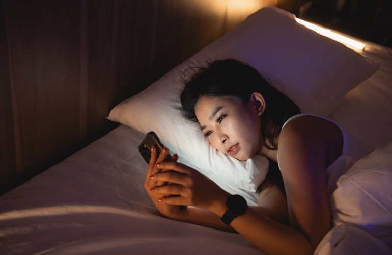 Checking social media in bed