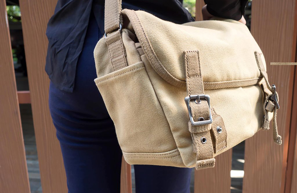 Carrying a heavy bag on one shoulder