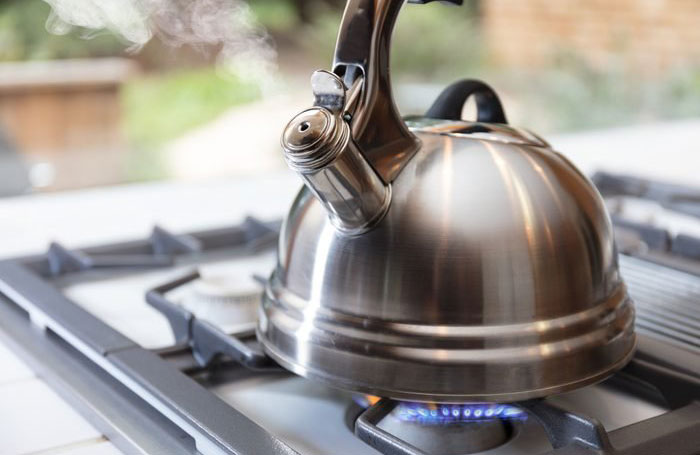 Steam out wrinkles with a kettle