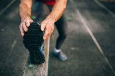 Man stretching hamstrings