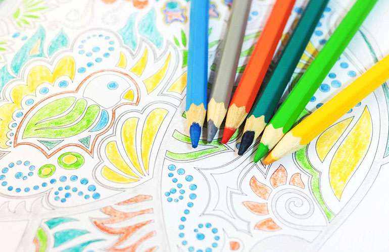 Colour in an adult colouring book