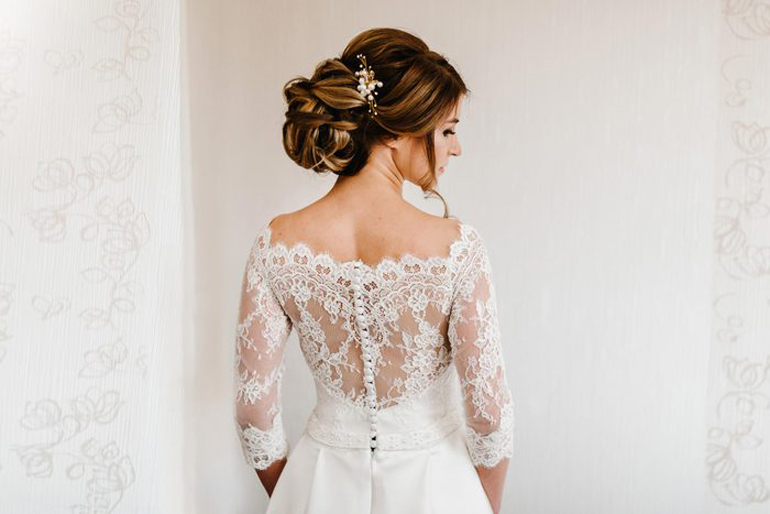 Wearing a white wedding dress