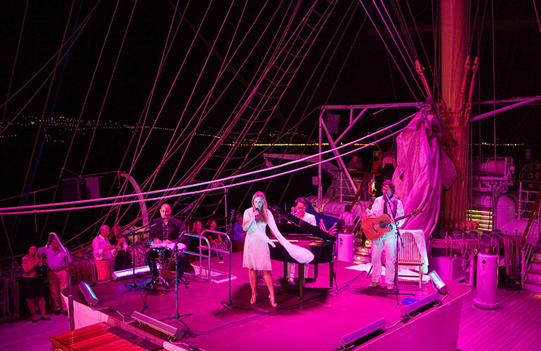 Sharing positive feedback about entertainers to the cruise director or guest services