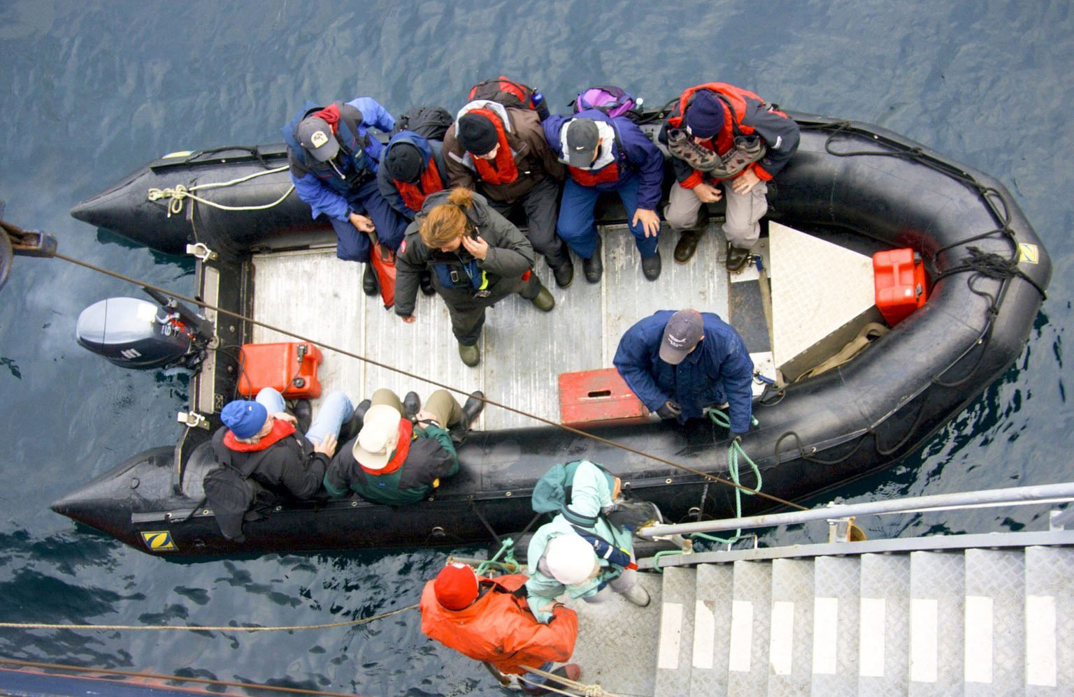 Helping to bring in the boat after an excursion or expedition