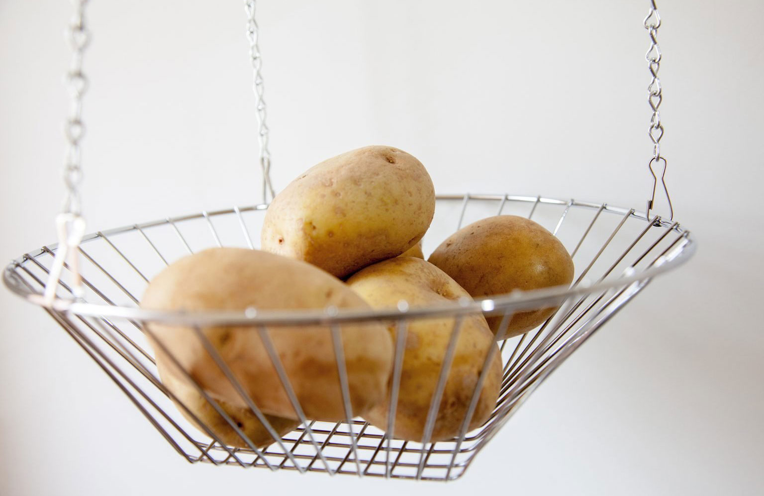 Hang produce in baskets