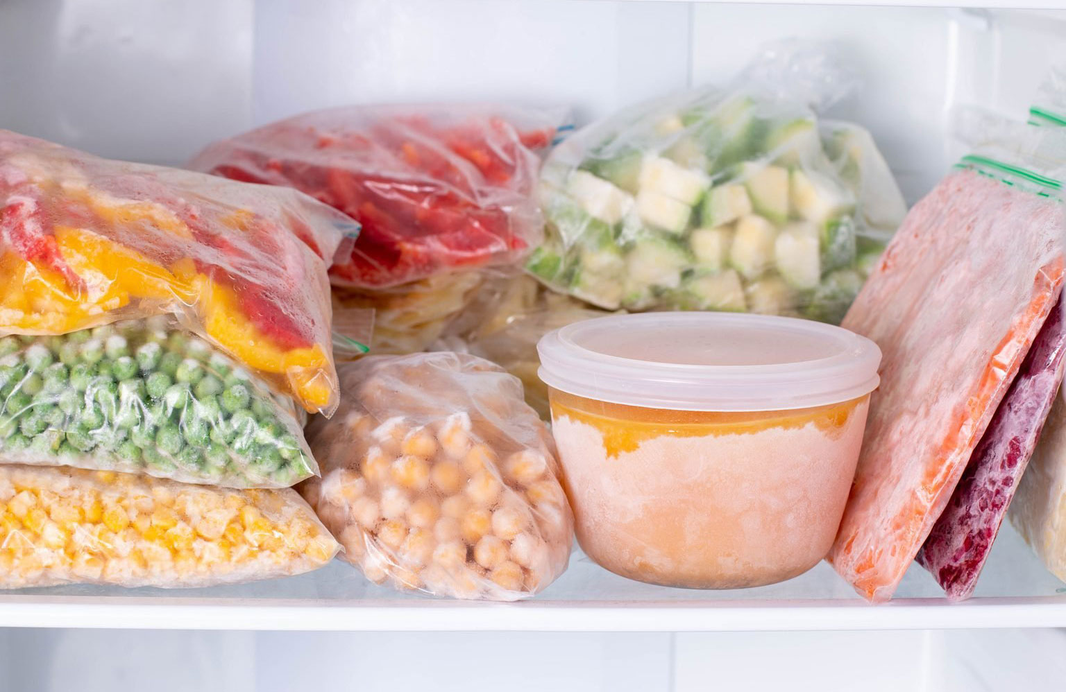 Repurpose plastic magazine holders in your freezer