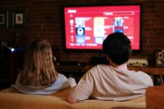 a couple choosing program to watch