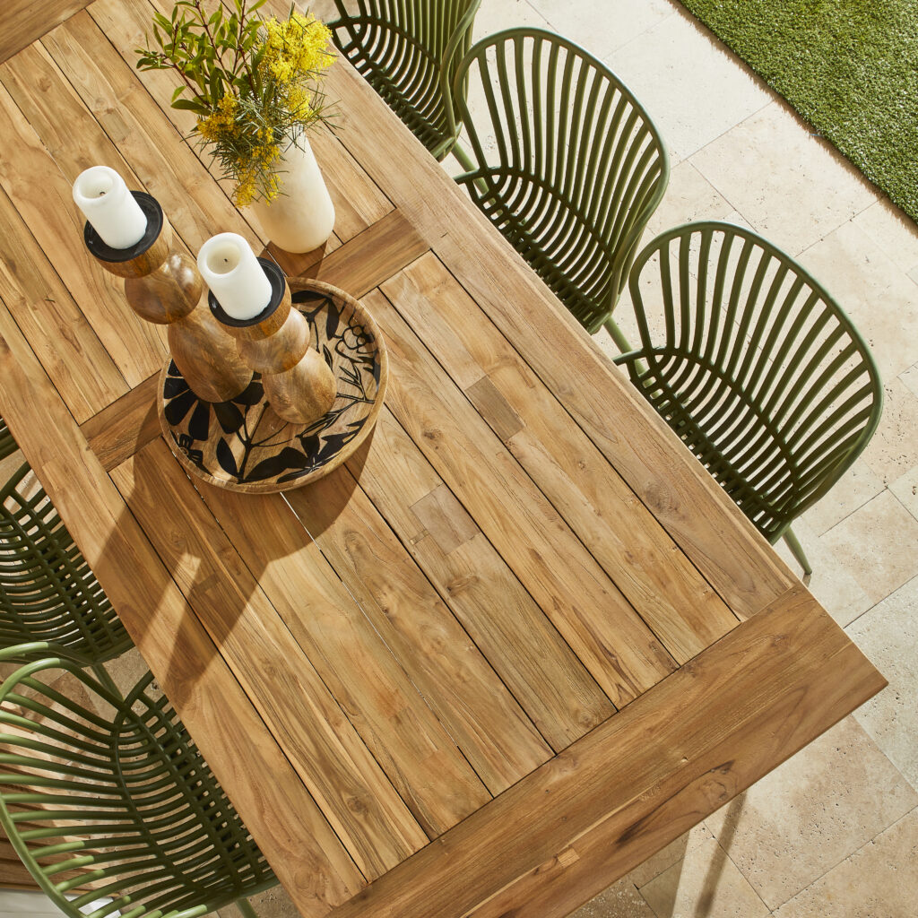A wooden outdoor table with chairs