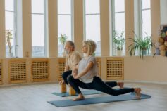A senior couple practising yoga together