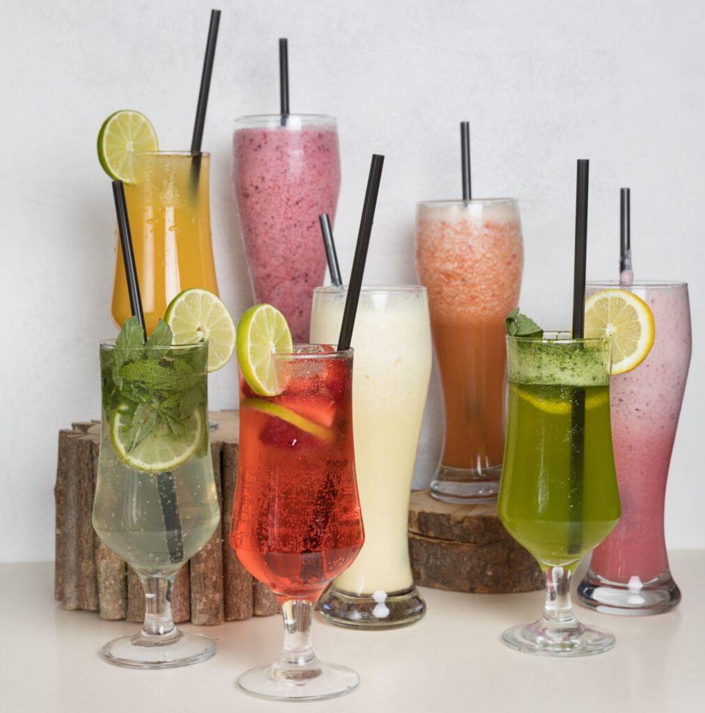 A selection of glasses filled with soft drinks, juice and smoothies.