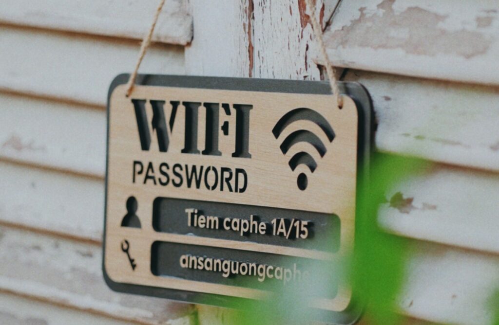 A wooden board with a public wifi user name and password