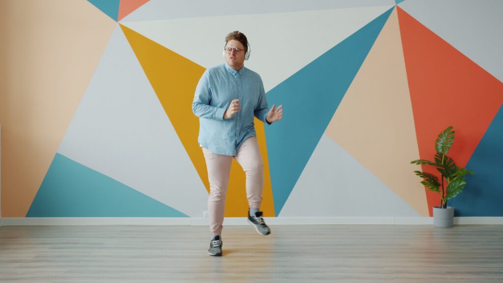 Man dancing while wearing headphones